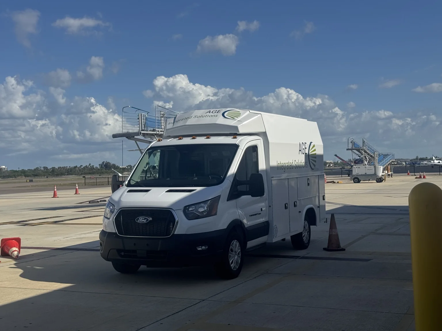 AGE service truck working inside an active airport environment