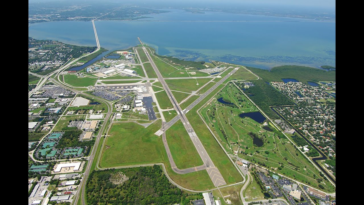 Aerial view of a Florida airport and surrounding commercial infrastructure